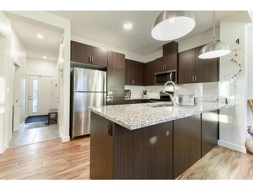 92 Walden Lane Se, Calgary, AB - Indoor Photo Showing Kitchen With Stainless Steel Kitchen