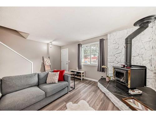 46-6020 Temple Drive Ne, Calgary, AB - Indoor Photo Showing Living Room With Fireplace