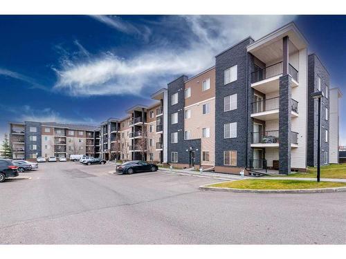 320-7180 80 Avenue Ne, Calgary, AB - Outdoor With Balcony With Facade