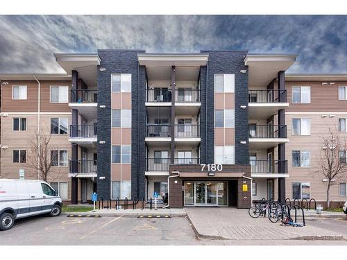 320-7180 80 Avenue Ne, Calgary, AB - Outdoor With Balcony With Facade