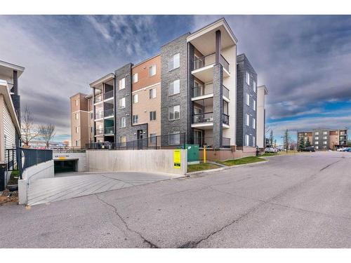 320-7180 80 Avenue Ne, Calgary, AB - Outdoor With Balcony With Facade