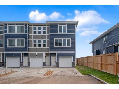 605-33 Merganser Drive, Chestermere, AB - Outdoor With Facade