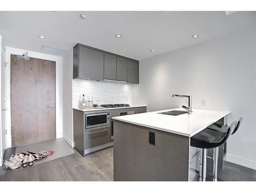 1606-1025 5Ave Sw, Calgary, AB - Indoor Photo Showing Kitchen With Double Sink With Upgraded Kitchen