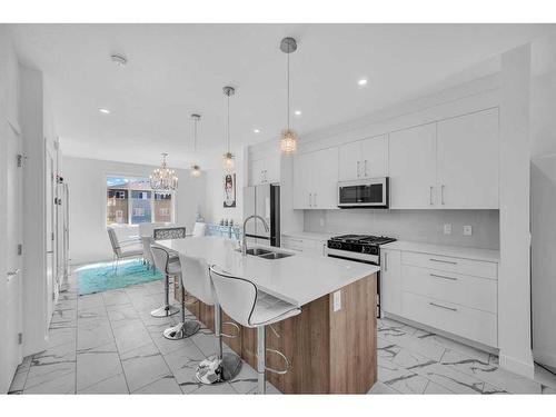 258 Chelsea Place Place, Chestermere, AB - Indoor Photo Showing Kitchen With Double Sink With Upgraded Kitchen