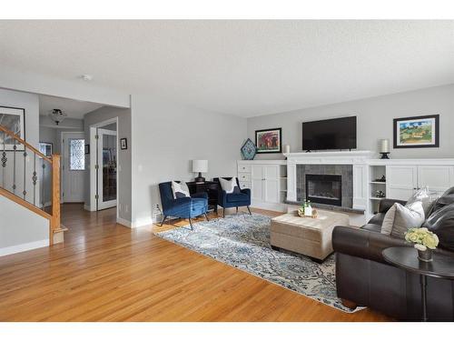 52 Westpoint Gardens Sw, Calgary, AB - Indoor Photo Showing Living Room With Fireplace