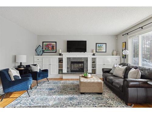 52 Westpoint Gardens Sw, Calgary, AB - Indoor Photo Showing Living Room With Fireplace