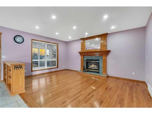 281 Westchester Green, Chestermere, AB - Indoor Photo Showing Living Room With Fireplace