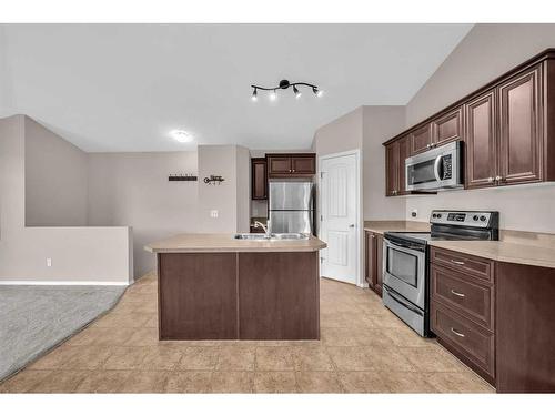 201-30 Panatella Landing Nw, Calgary, AB - Indoor Photo Showing Kitchen With Double Sink