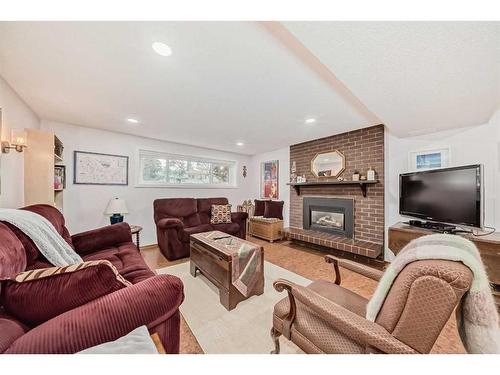 183 Lake Adams Crescent Se, Calgary, AB - Indoor Photo Showing Living Room With Fireplace