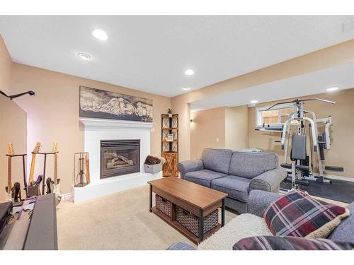 40 River Rock Circle Se, Calgary, AB - Indoor Photo Showing Living Room With Fireplace