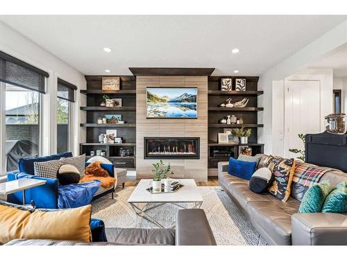 437 Evergreen Circle Sw, Calgary, AB - Indoor Photo Showing Living Room With Fireplace