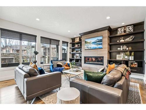 437 Evergreen Circle Sw, Calgary, AB - Indoor Photo Showing Living Room With Fireplace