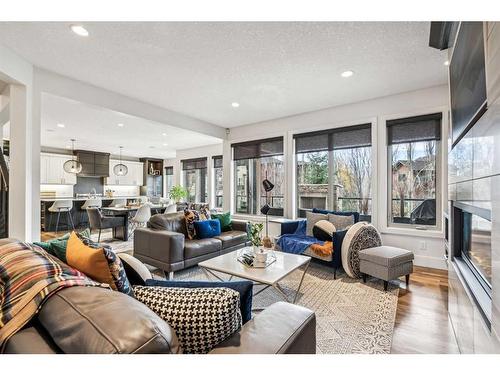 437 Evergreen Circle Sw, Calgary, AB - Indoor Photo Showing Living Room With Fireplace