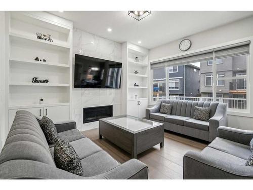 40 Waterford Terrace, Chestermere, AB - Indoor Photo Showing Living Room With Fireplace