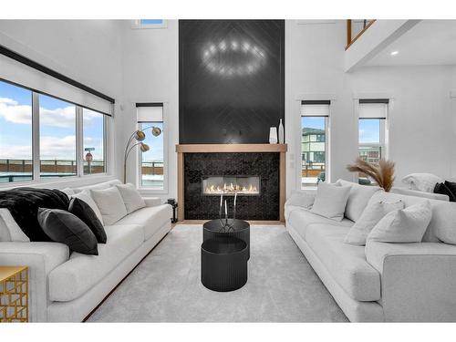 88 Fieldstone Close, Balzac, AB - Indoor Photo Showing Living Room With Fireplace