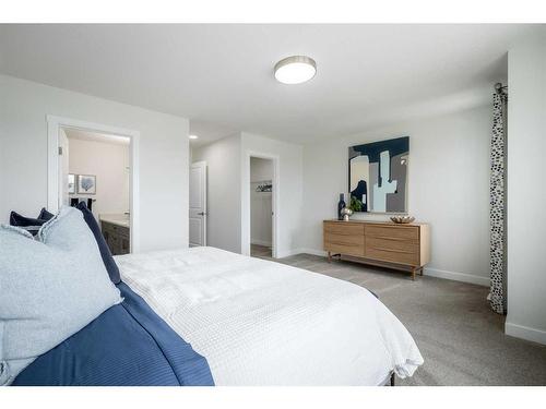 26 Belgian Court, Cochrane, AB - Indoor Photo Showing Bedroom