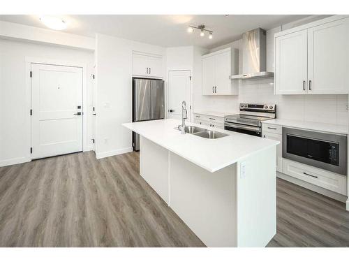 1305-55 Lucas Way Nw, Calgary, AB - Indoor Photo Showing Kitchen With Double Sink