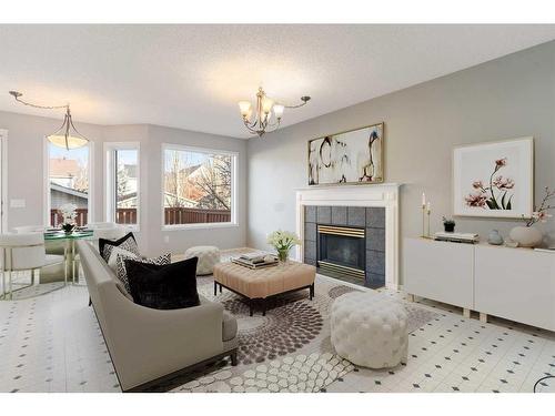 67 Inverness Gardens Se, Calgary, AB - Indoor Photo Showing Living Room With Fireplace