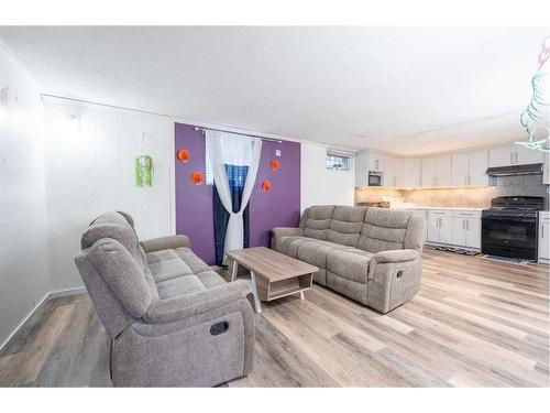 3407 30A Avenue Se, Calgary, AB - Indoor Photo Showing Living Room With Fireplace