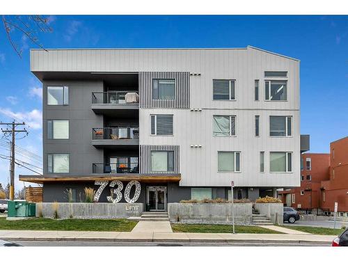 305-730 5 Street Ne, Calgary, AB - Outdoor With Balcony With Facade