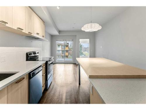 305-730 5 Street Ne, Calgary, AB - Indoor Photo Showing Kitchen With Stainless Steel Kitchen