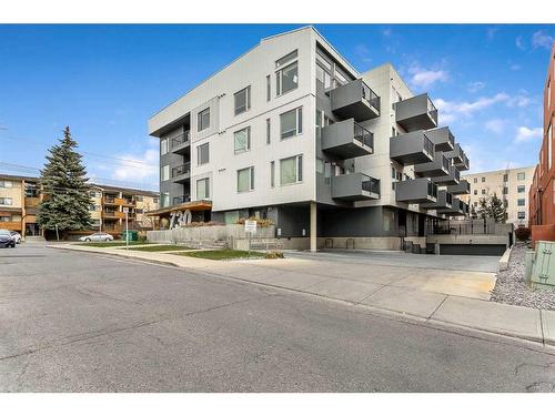 305-730 5 Street Ne, Calgary, AB - Outdoor With Balcony With Facade