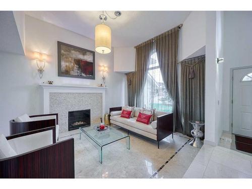 2628 Signal Ridge View Sw, Calgary, AB - Indoor Photo Showing Living Room With Fireplace