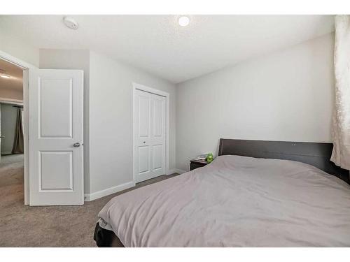 311 Carringvue Way Nw, Calgary, AB - Indoor Photo Showing Bedroom