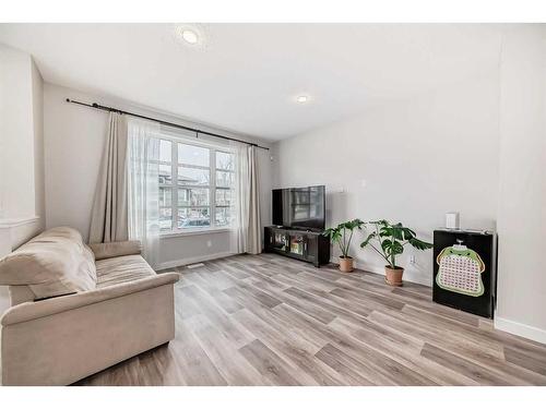 311 Carringvue Way Nw, Calgary, AB - Indoor Photo Showing Living Room