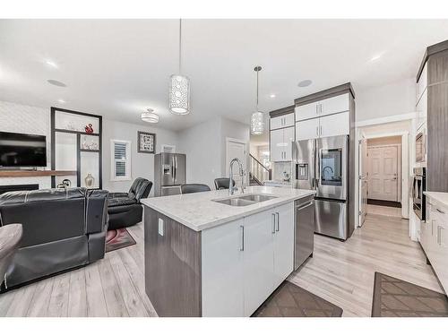 614 Kingsmere Way Se, Airdrie, AB - Indoor Photo Showing Kitchen With Double Sink With Upgraded Kitchen