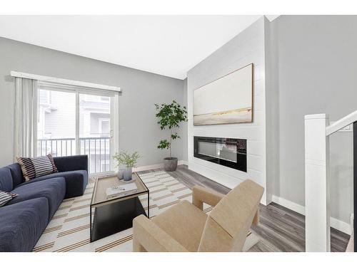 510-95 Skyview Close Ne, Calgary, AB - Indoor Photo Showing Living Room With Fireplace