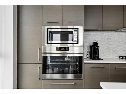 703-1025 5 Avenue Sw, Calgary, AB - Indoor Photo Showing Kitchen With Stainless Steel Kitchen With Upgraded Kitchen