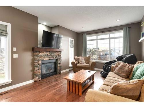 1803 High Park Boulevard Nw, High River, AB - Indoor Photo Showing Living Room With Fireplace