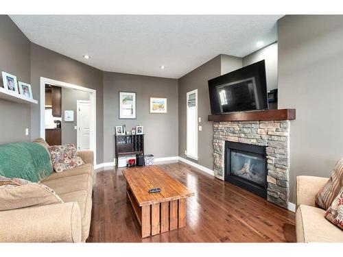 1803 High Park Boulevard Nw, High River, AB - Indoor Photo Showing Living Room With Fireplace