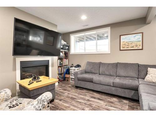 1803 High Park Boulevard Nw, High River, AB - Indoor Photo Showing Living Room With Fireplace