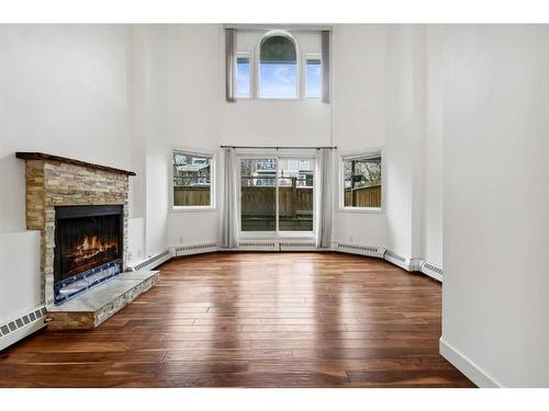 105-1720 13 Street Sw, Calgary, AB - Indoor Photo Showing Living Room With Fireplace