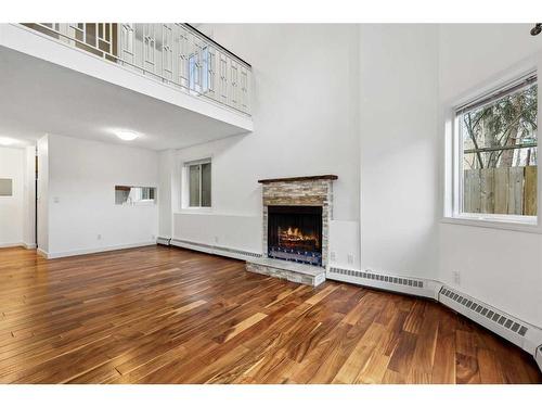 105-1720 13 Street Sw, Calgary, AB - Indoor Photo Showing Living Room With Fireplace