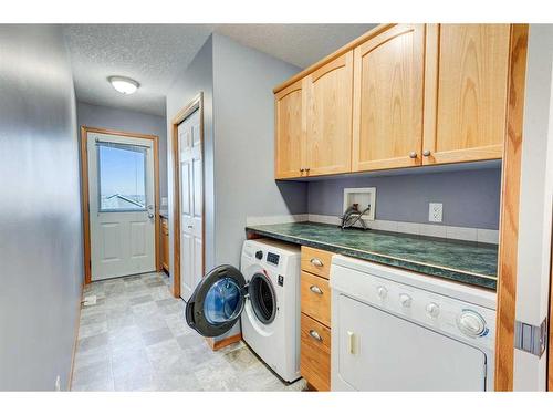 313 Robert Street Sw, Diamond Valley, AB - Indoor Photo Showing Laundry Room