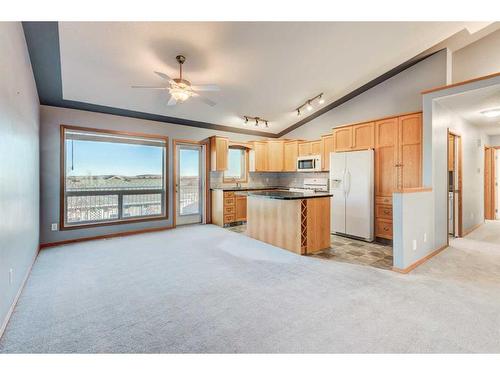 313 Robert Street Sw, Diamond Valley, AB - Indoor Photo Showing Kitchen