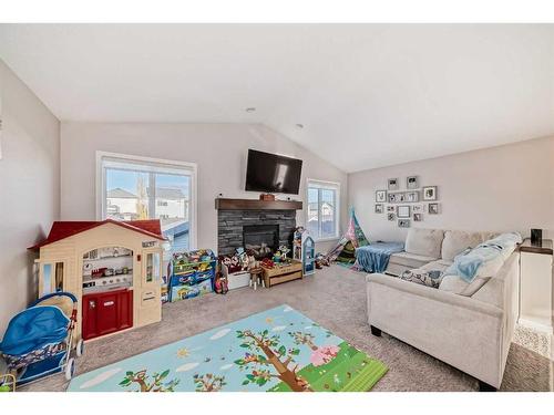 2103 New Brighton Park Se, Calgary, AB - Indoor Photo Showing Living Room With Fireplace