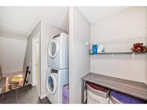 2103 New Brighton Park Se, Calgary, AB - Indoor Photo Showing Laundry Room