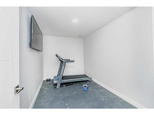 7 Mystic Ridge Way Sw, Calgary, AB - Indoor Photo Showing Gym Room