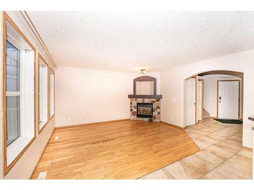 200 Somerglen Common Sw, Calgary, AB - Indoor With Fireplace