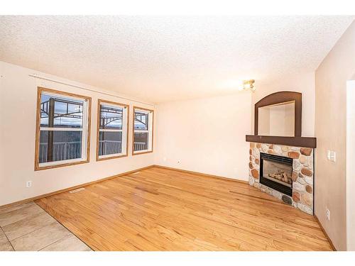 200 Somerglen Common Sw, Calgary, AB - Indoor Photo Showing Living Room With Fireplace