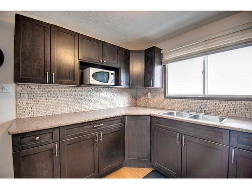 4730 70 Street Nw, Calgary, AB - Indoor Photo Showing Kitchen With Double Sink