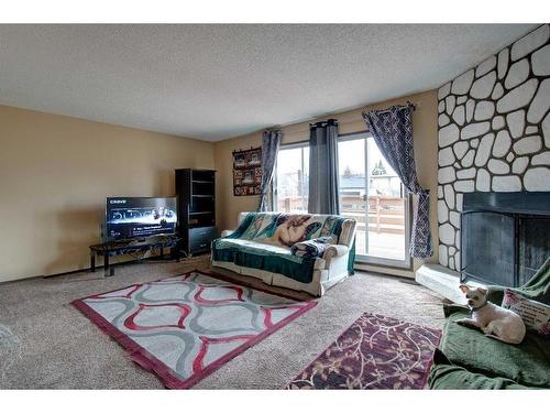 4730 70 Street Nw, Calgary, AB - Indoor Photo Showing Living Room With Fireplace