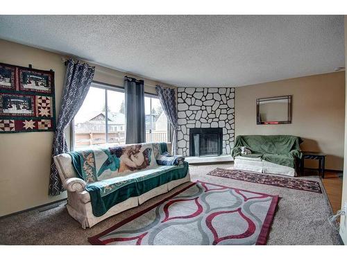 4730 70 Street Nw, Calgary, AB - Indoor Photo Showing Living Room With Fireplace