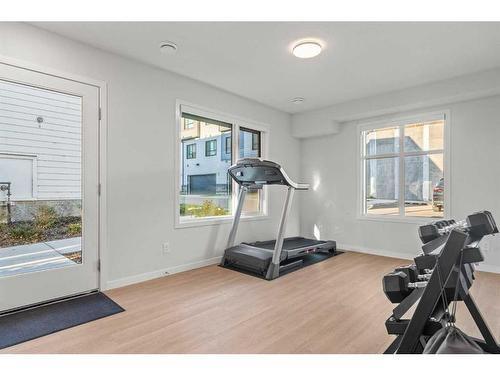 124-42 Cranbrook Gardens Se, Calgary, AB - Indoor Photo Showing Gym Room