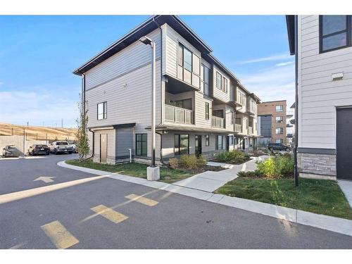 124-42 Cranbrook Gardens Se, Calgary, AB - Outdoor With Balcony With Facade