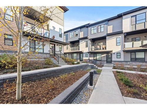 124-42 Cranbrook Gardens Se, Calgary, AB - Outdoor With Balcony With Facade